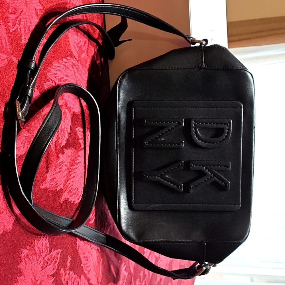 DKNY Black Purse, shoulder strap, outside and inside pocket.